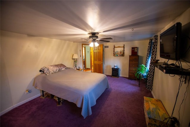 bedroom with ceiling fan and dark colored carpet