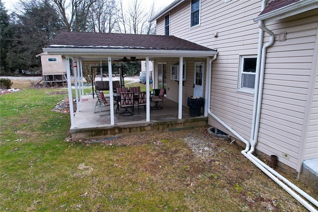 exterior space featuring ceiling fan