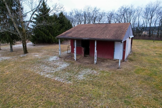 view of outdoor structure with a lawn