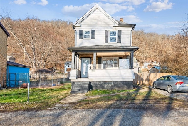 front of property featuring covered porch