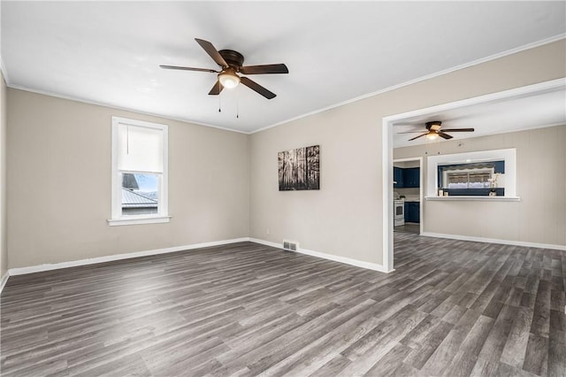 spare room featuring hardwood / wood-style floors and ornamental molding