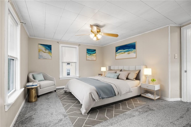 bedroom with crown molding, carpet, and ceiling fan