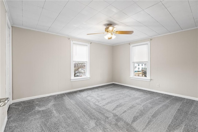 carpeted empty room with crown molding and ceiling fan