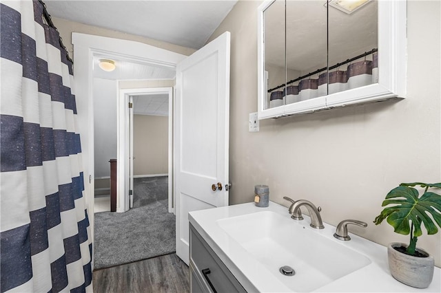 bathroom with wood-type flooring and vanity