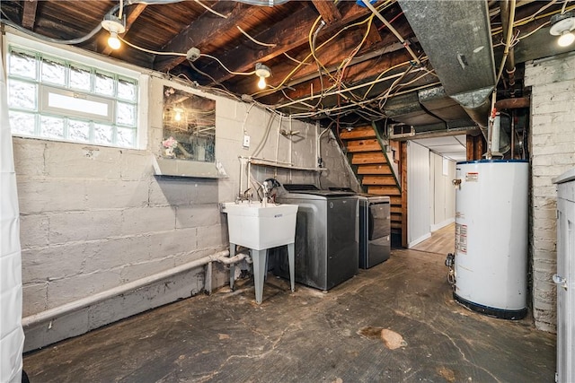 basement with gas water heater and separate washer and dryer