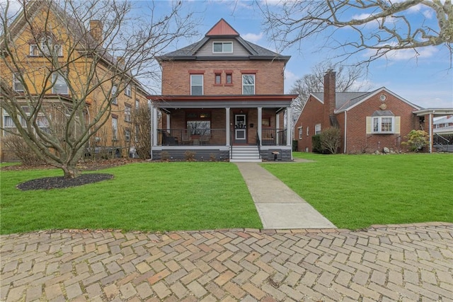 view of front facade with covered porch and a front yard