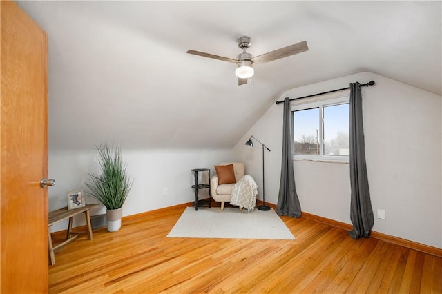 sitting room featuring vaulted ceiling, ceiling fan, and light hardwood / wood-style floors