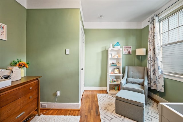 living area with light hardwood / wood-style flooring