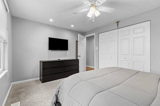 bedroom with ceiling fan and a closet