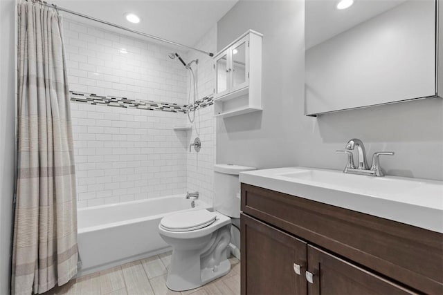 full bathroom featuring vanity, toilet, and shower / bathtub combination with curtain