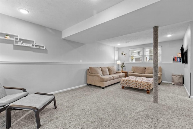 carpeted living room with a textured ceiling