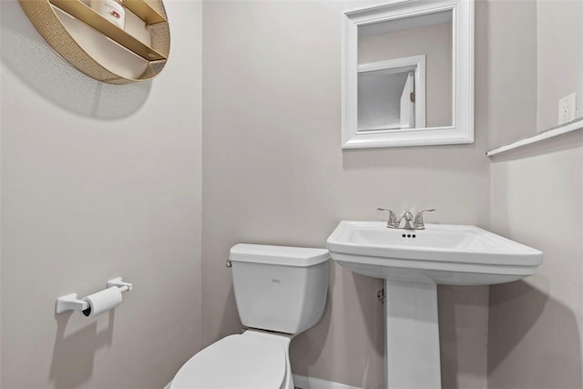 bathroom with toilet and sink