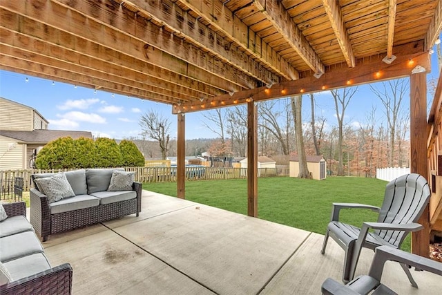 view of patio / terrace featuring a shed and an outdoor living space