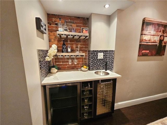 bar with refrigerator, sink, beverage cooler, and decorative backsplash