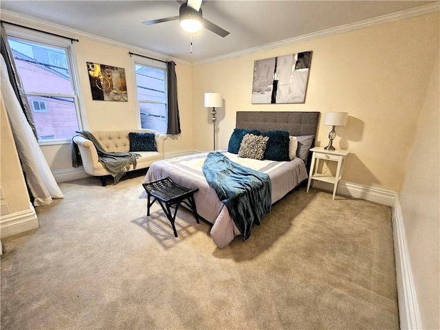 bedroom with ceiling fan, ornamental molding, and carpet floors