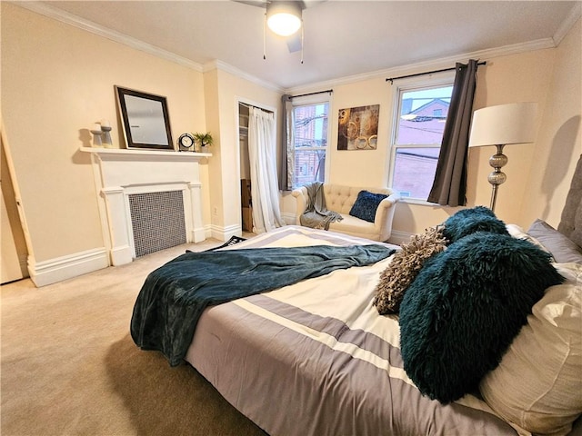 bedroom with light carpet, ceiling fan, a closet, and crown molding