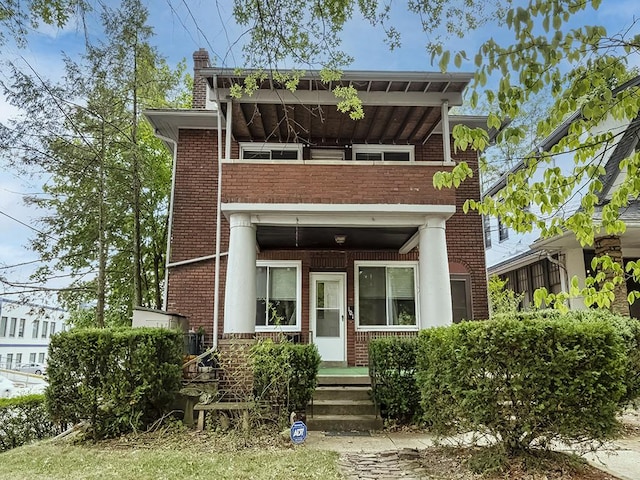 view of front of home with a balcony