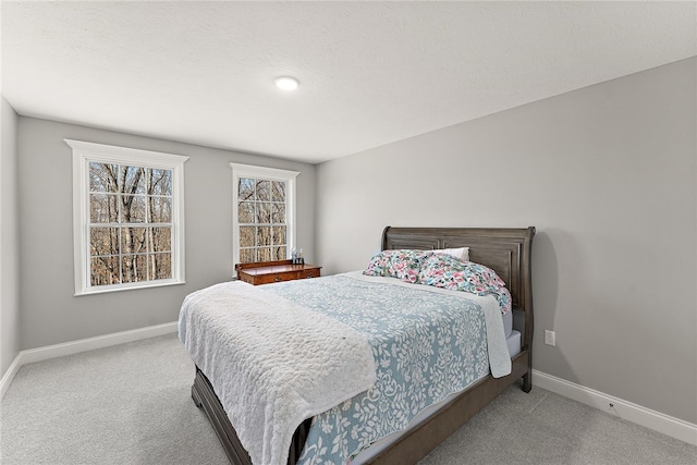 carpeted bedroom with a textured ceiling