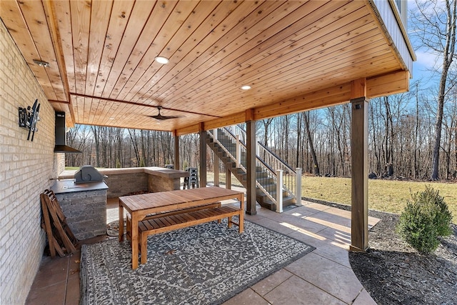 view of patio with ceiling fan and exterior kitchen