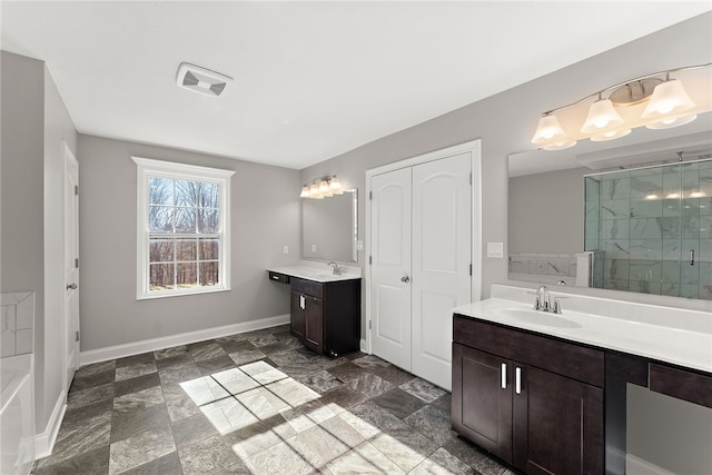 bathroom with vanity and an enclosed shower