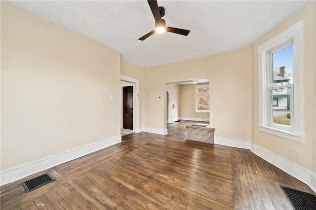 unfurnished living room featuring hardwood / wood-style floors and ceiling fan