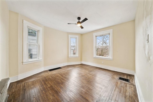 empty room featuring hardwood / wood-style floors and ceiling fan