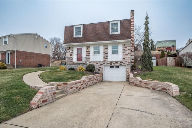 view of front of house featuring a garage and a front yard