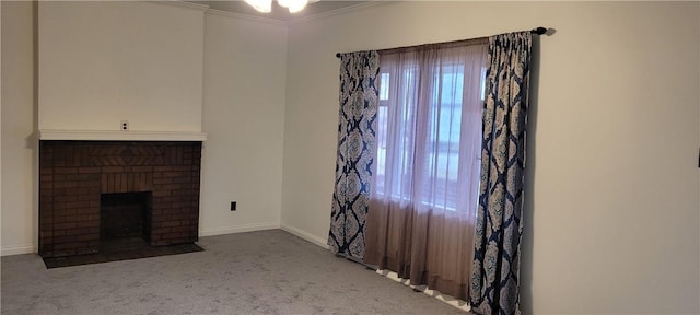 unfurnished living room with crown molding, carpet floors, and a fireplace