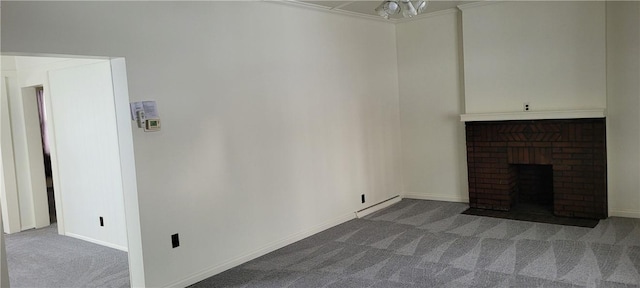 unfurnished living room featuring a brick fireplace and carpet floors