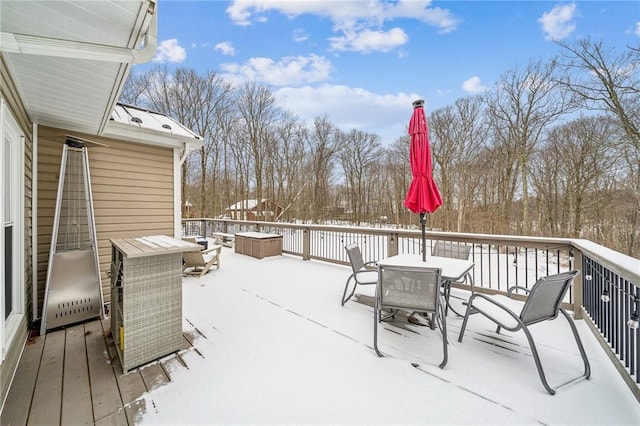 view of snow covered deck