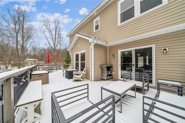 view of snow covered patio