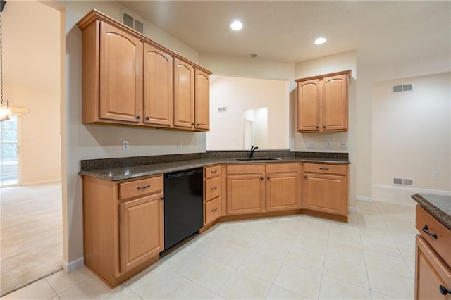 kitchen with black dishwasher, sink, light tile patterned floors, and dark stone counters