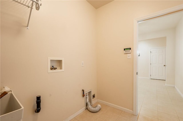 laundry area featuring sink, hookup for an electric dryer, hookup for a washing machine, and light tile patterned floors