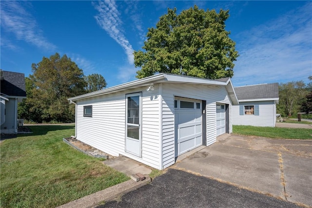 garage with a yard