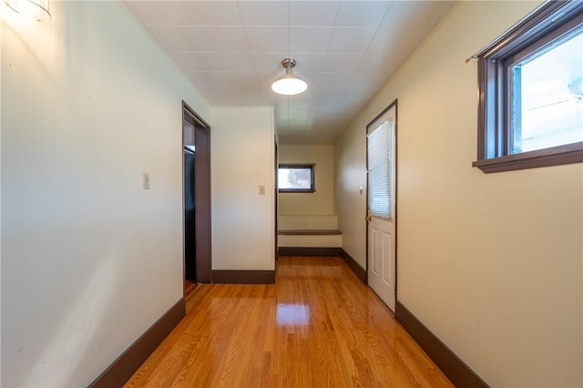 hall with light wood-type flooring