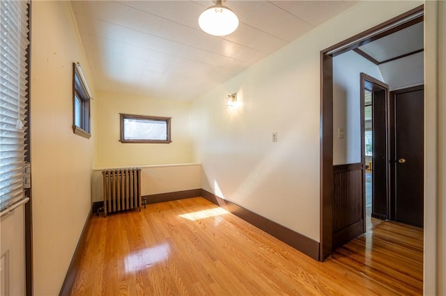 interior space featuring radiator and light wood-type flooring