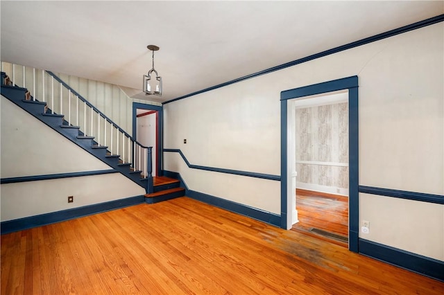 empty room with wood-type flooring