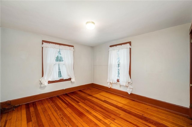 empty room featuring hardwood / wood-style flooring