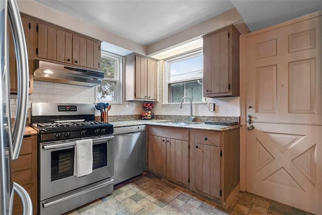 kitchen with tasteful backsplash, sink, and stainless steel appliances