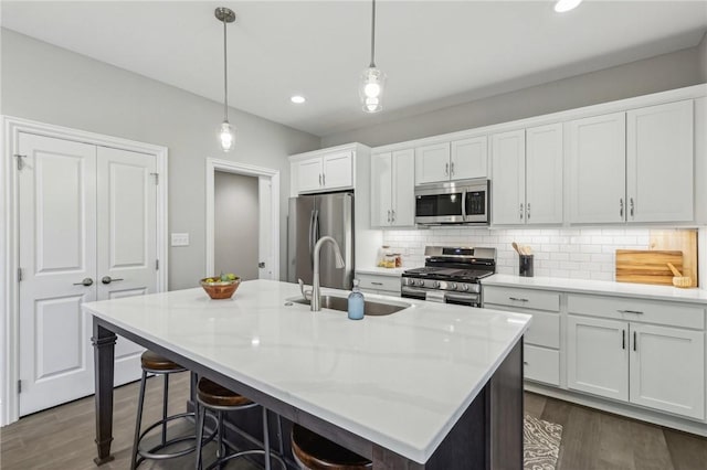 1045 Lakeside Dr, Mcdonald Wsh, PA 15057 - kitchen with appliances with stainless steel finishes, a kitchen island with sink, sink, and white cabinets