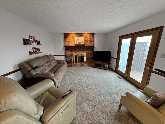 living room featuring light colored carpet, a textured ceiling, and a fireplace