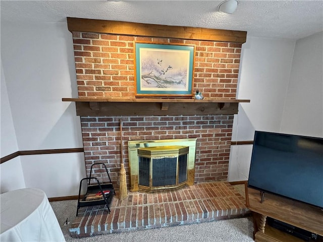 living room featuring a brick fireplace, a textured ceiling, and carpet