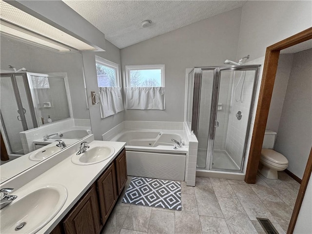 full bathroom with lofted ceiling, toilet, a textured ceiling, vanity, and independent shower and bath