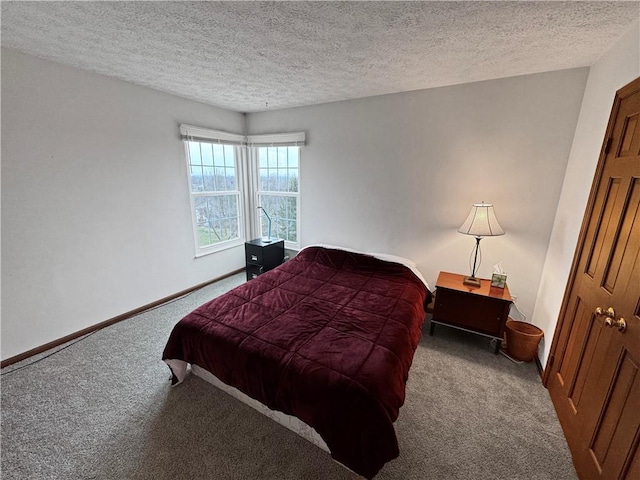 carpeted bedroom with a textured ceiling