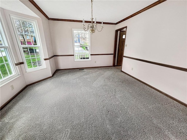 unfurnished room with carpet, baseboards, an inviting chandelier, and ornamental molding