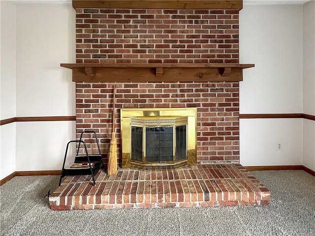 interior details with a fireplace, baseboards, and carpet floors
