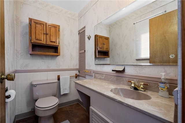 bathroom with tile patterned floors, vanity, and toilet