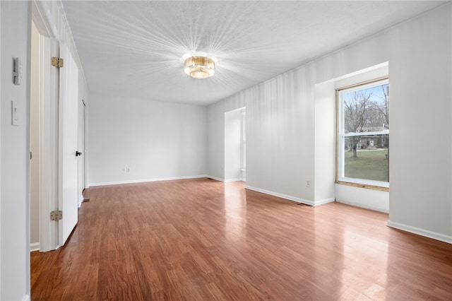 unfurnished room featuring hardwood / wood-style floors