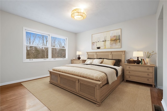 bedroom with wood-type flooring