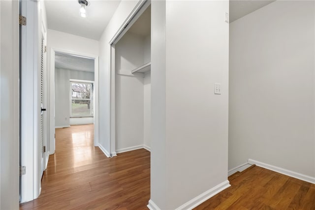 hall with dark wood-type flooring